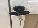 Locking t handle on shed door