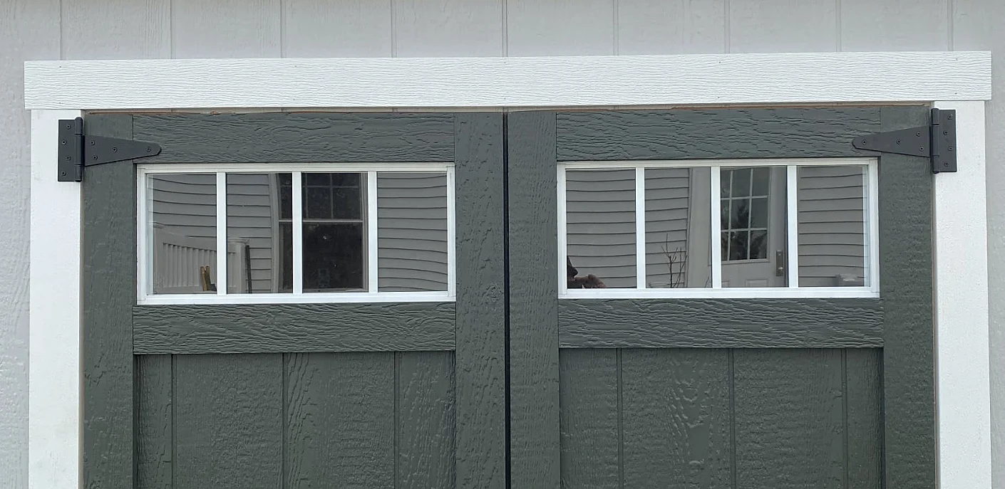 Picture of transom window at top of shed door for aesthetic and light